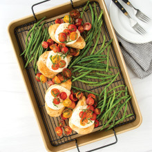 Nordic Ware nonstick high-sided baking tray with golden roasted chicken thighs and crispy green beans