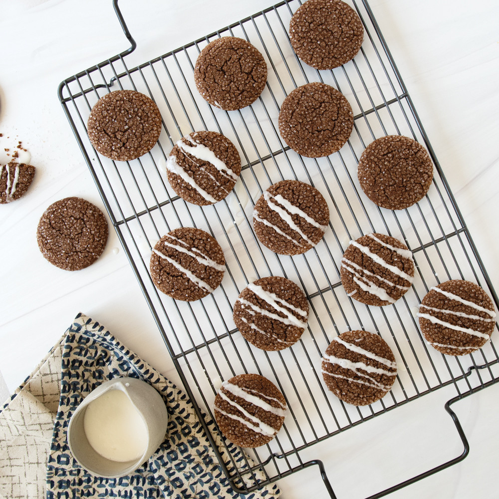 Nordic Ware nonstick high-sided baking tray with wire rack holding golden baked chocolate chip cookies
