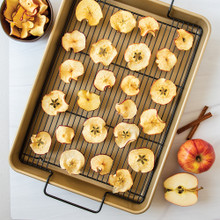 Nordic Ware nonstick high-sided rectangular baking tray with golden caramelized apple slices arranged in rows