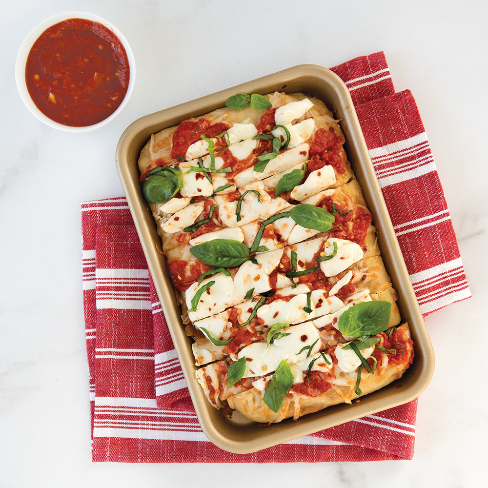 Nordic Ware aluminum eighth sheet pan with golden-brown baked chicken parmesan, natural finish nonstick surface