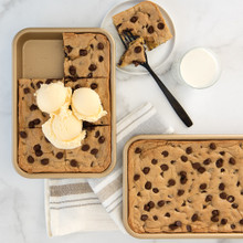 Two Nordic Ware aluminum eighth sheet pans with nonstick coating, one holding baked cookies, the other with scooped ice cream
