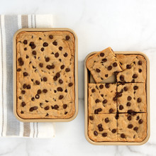 Two Nordic Ware aluminum eighth sheet pans with nonstick coating, topped with golden baked cookies