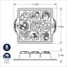 Nordic Ware aluminum baking pan with 16 square cavities featuring seasonal designs, natural silver finish