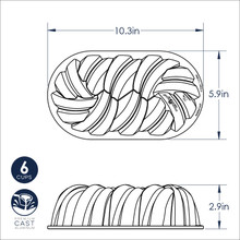 Nordic Ware aluminum braided loaf pan with decorative rope-like ridged pattern, natural silver finish