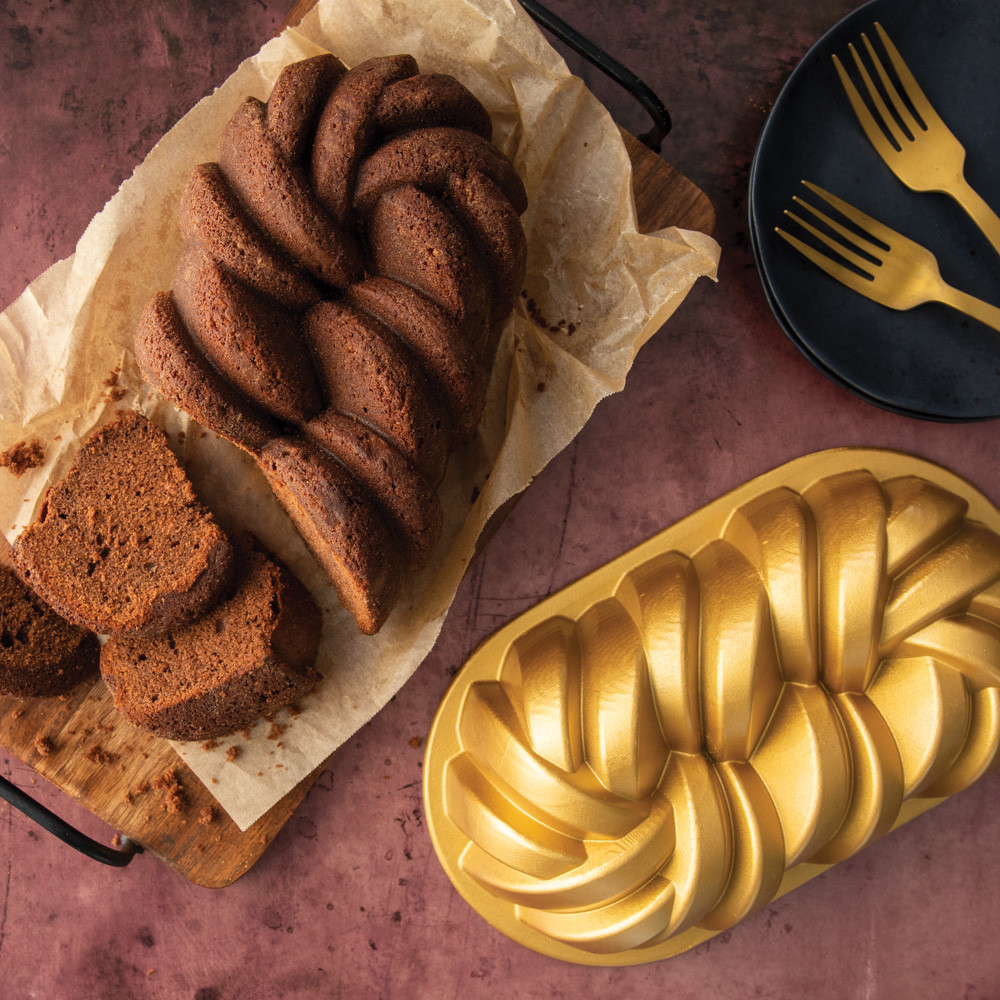 Golden braided loaf cake baked in Nordic Ware aluminum braided loaf pan, showing detailed rope pattern