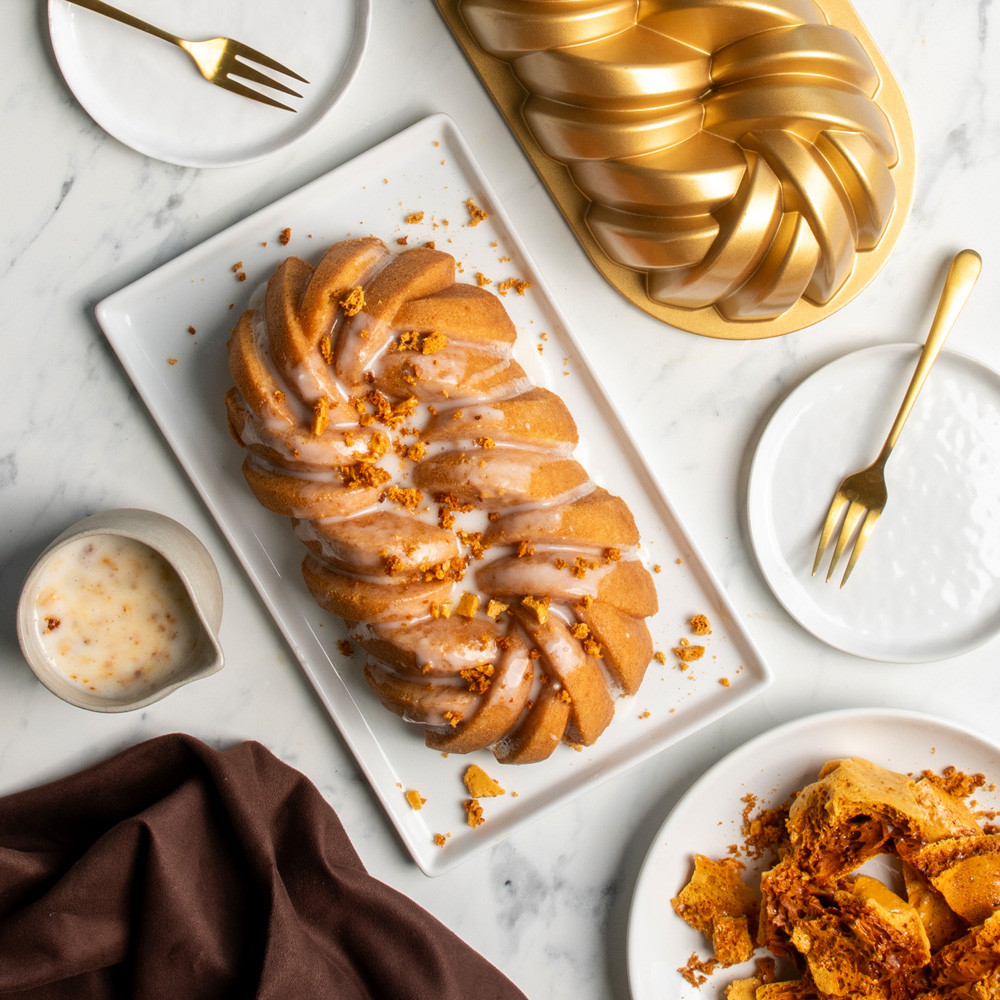 plated golden loaf with glaze and crumble toppings baked in nordic ware braided loaf pan with twisted rope design
