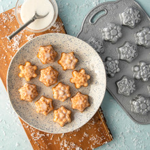 Nordic Ware aluminum Frosty Flakes Bites pan with golden baked bite-sized treats arranged on white plate