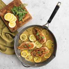 Nordic Ware Verde ceramic nonstick 12-inch skillet with golden chicken piccata, lemon slices, and pasta