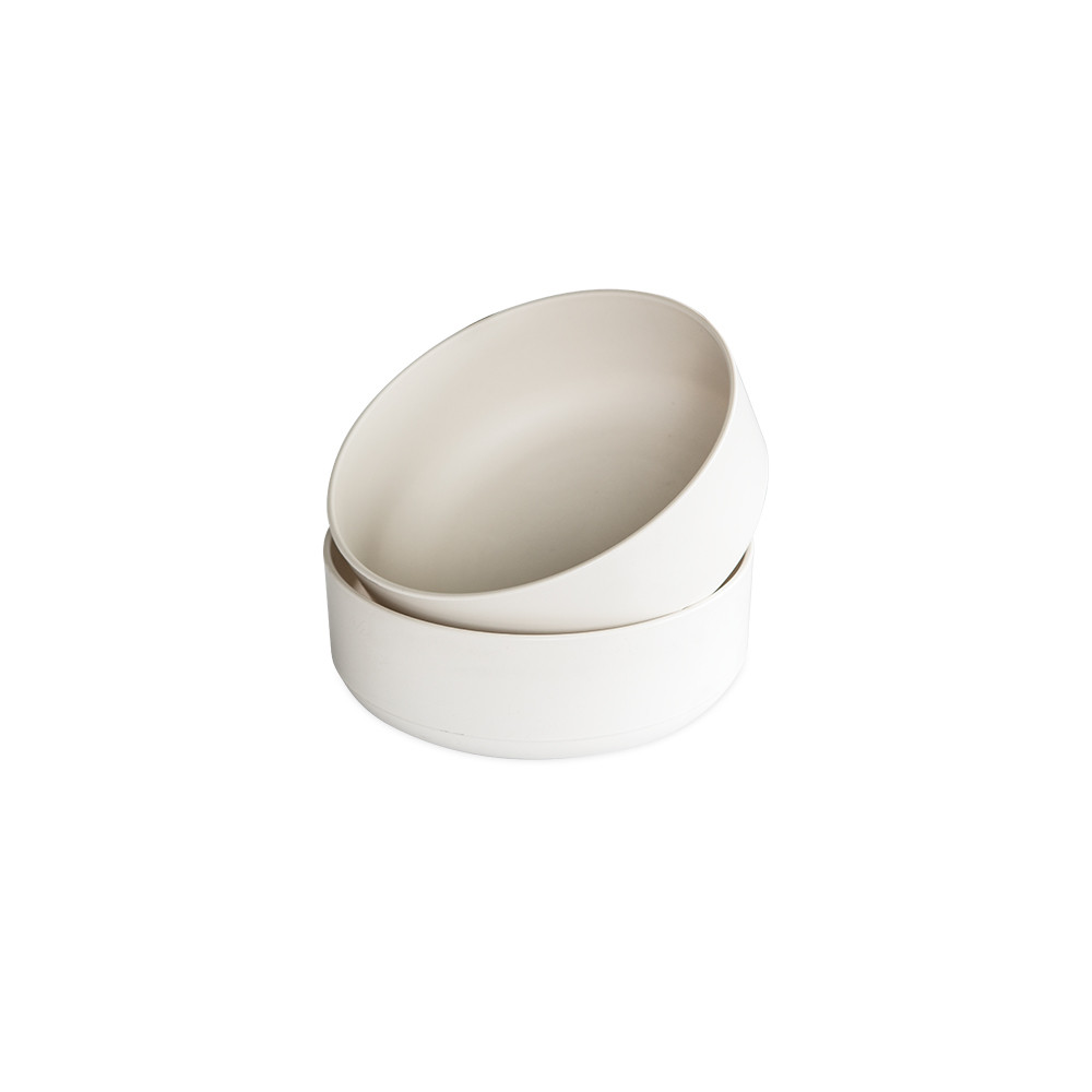 Two white ceramic Nordic Ware soup and salad bowls stacked together, showing smooth rounded design