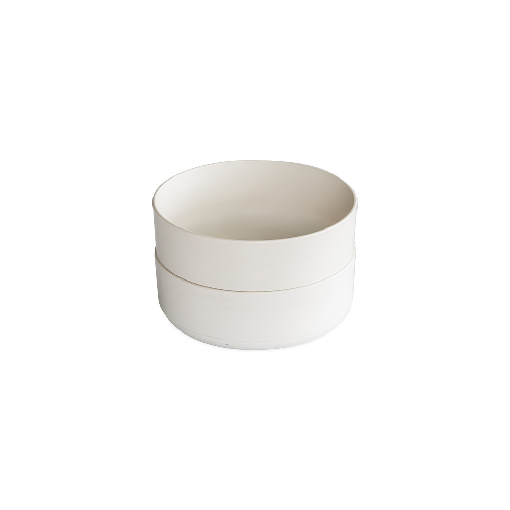 Two white ceramic Nordic Ware soup and salad bowls stacked, round with wide rims and smooth finish