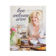 Nordic Ware "Love Welcome Serve" cookbook cover featuring colorful recipe photos and elegant typography