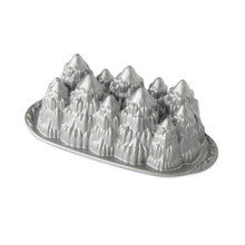 Nordic Ware Alpine Forest loaf pan, aluminum with detailed evergreen tree relief design, natural silver finish