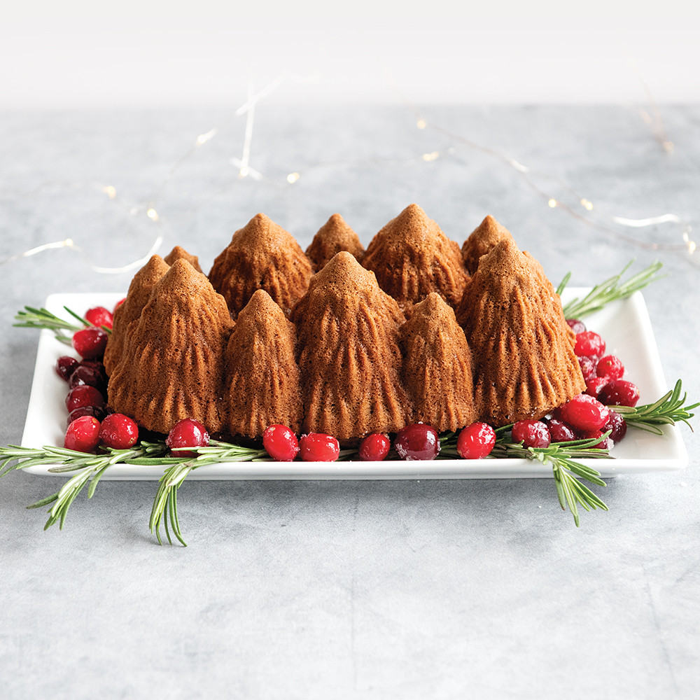 Nordic Ware aluminum Alpine Forest loaf pan showing detailed tree, mountain and wildlife relief design