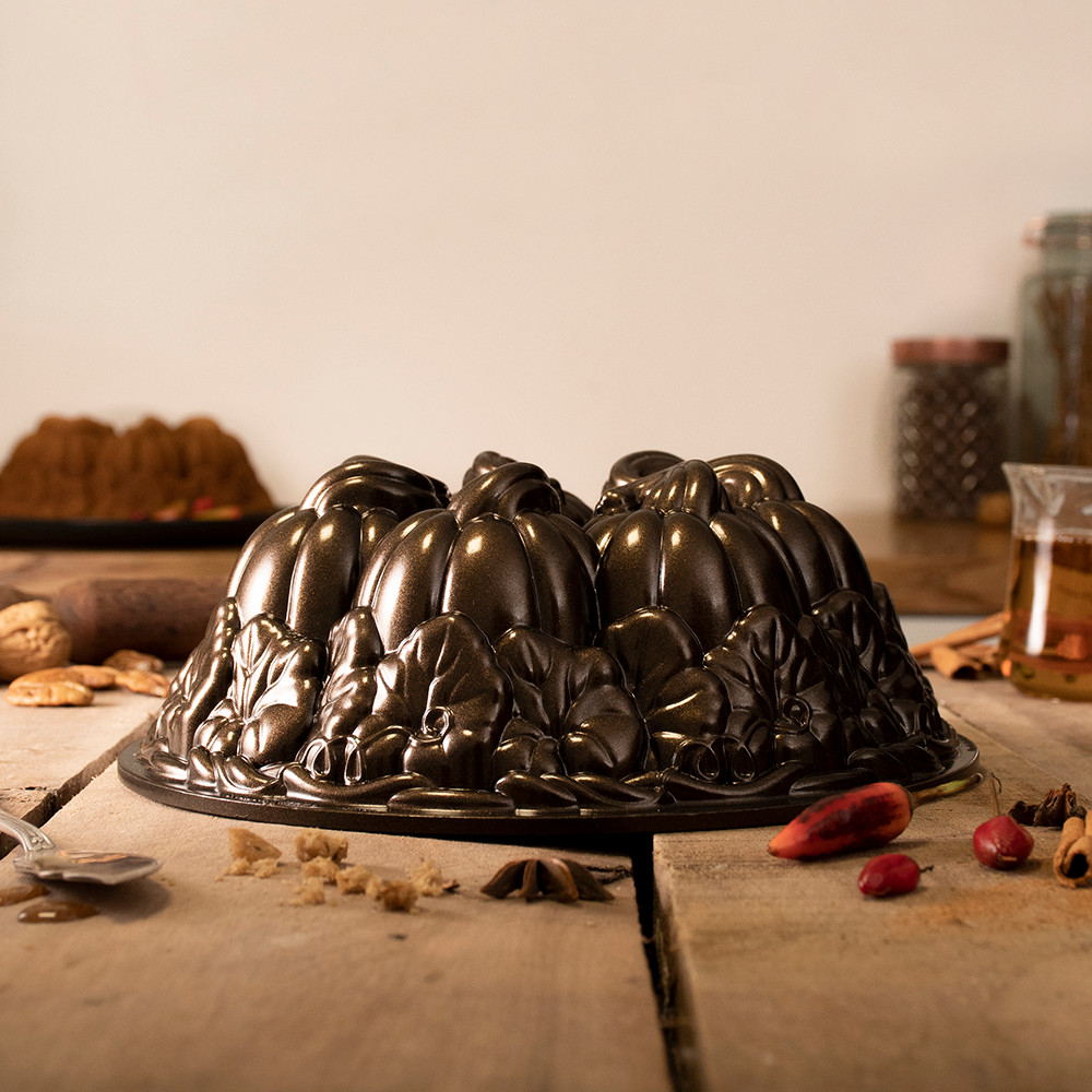 Nordic Ware aluminum pumpkin-shaped bundt pan with detailed ridged segments, natural silver finish