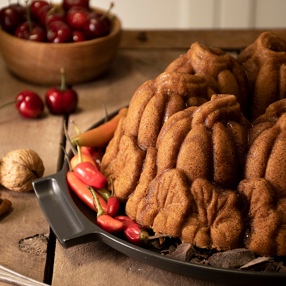 Golden bundt cake in Nordic Ware Pumpkin Patch pan showing detailed pumpkin and vine relief pattern
