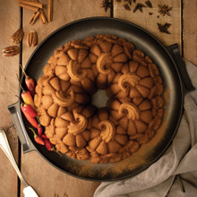 Golden bundt cake in Nordic Ware Pumpkin Patch pan showing detailed pumpkin-shaped ridges and swirled design