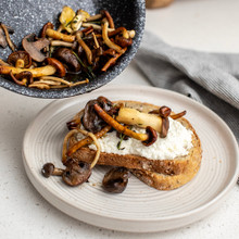 Nordic Ware Basalt black ceramic nonstick 8-inch skillet with golden sautéed mushrooms