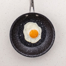 Nordic Ware Basalt ceramic nonstick 8-inch skillet with cooked sunny-side up egg, dark gray finish