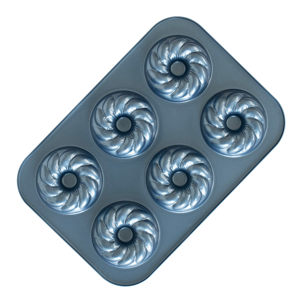 Nordic Ware aluminum French twist donut pan with 12 decorative fluted cavities, natural silver finish