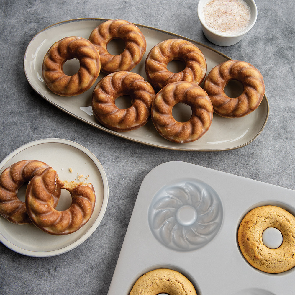 Nordic Ware aluminum French Twist donut pan with 6 twisted donuts baked inside, silver finish