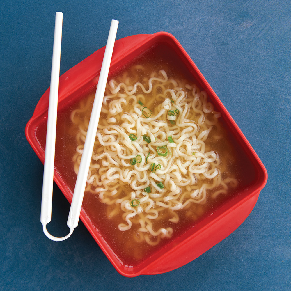 Nordic Ware aluminum ramen bowl with cooked ramen noodles, sliced green onions, and wooden chopsticks