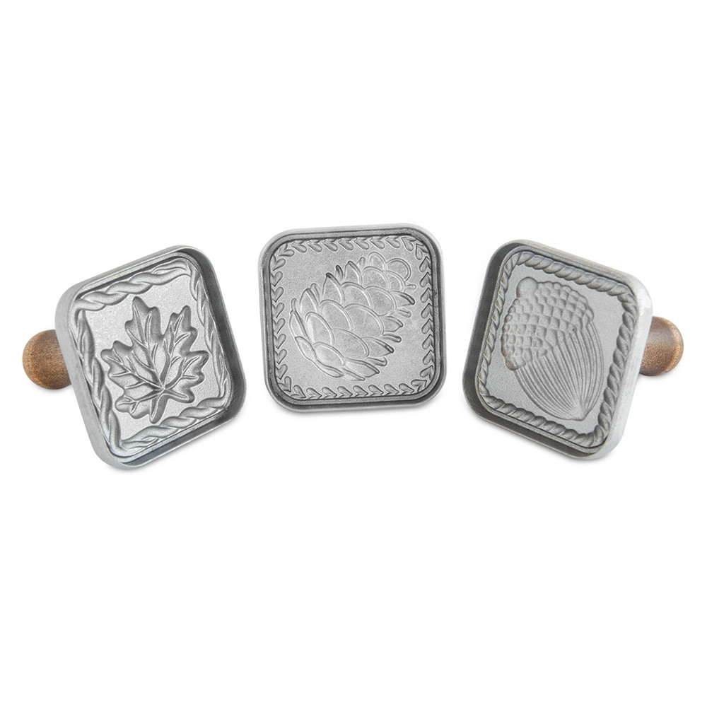 Nordic Ware white plastic square cookie stamps featuring autumn forest designs including acorns and leaves