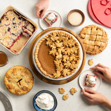 Nordic Ware aluminum pie pans with baked pumpkin pie, mini apple pies, and rectangular pie bars displayed