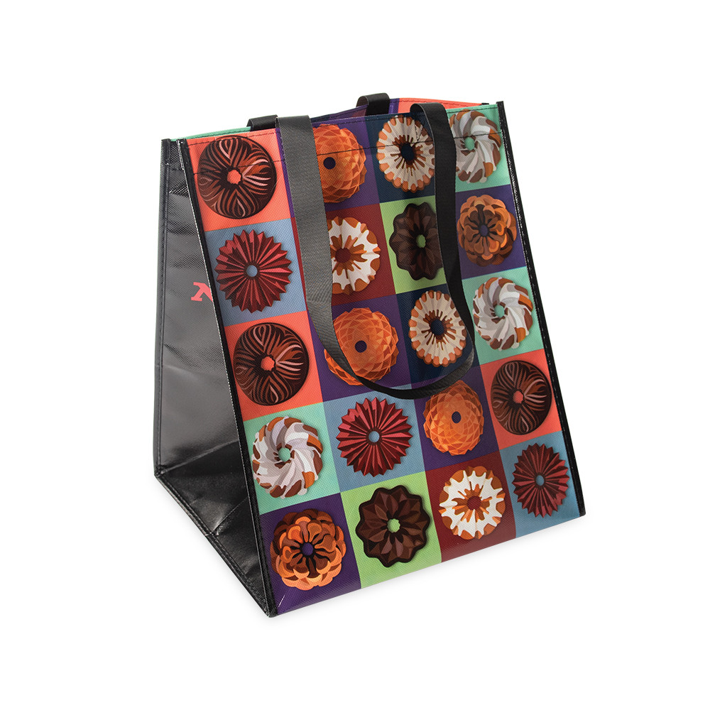 Nordic Ware white canvas tote bag with black handles and bundt cake graphic design