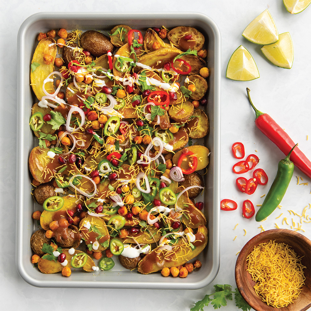 Nordic Ware Brilliant quarter sheet pan with roasted diced potatoes, bell peppers, and melted cheese