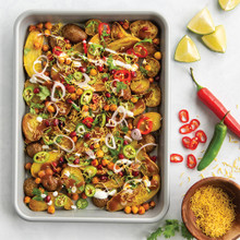 Nordic Ware Brilliant quarter sheet pan with roasted diced potatoes, bell peppers, and melted cheese