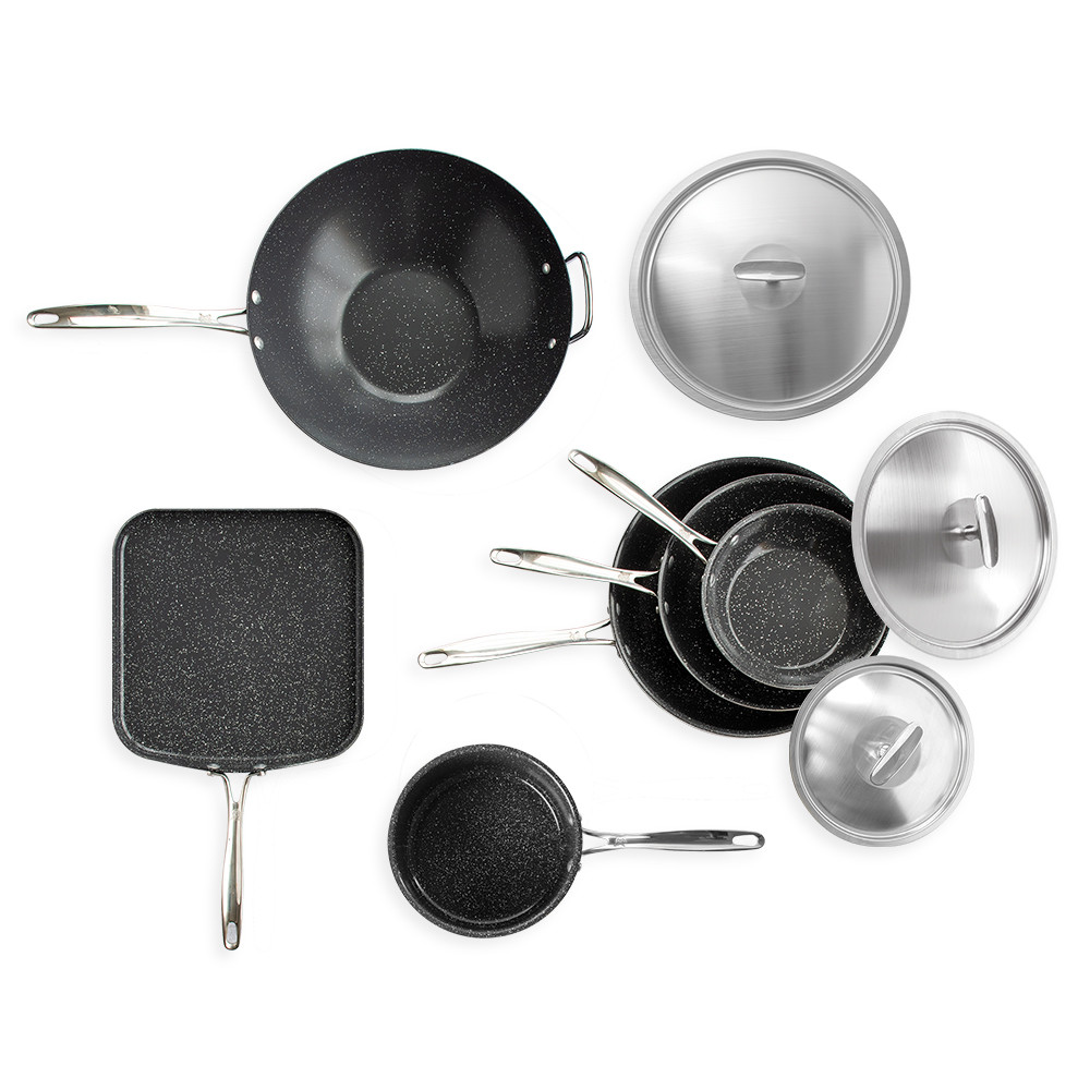 Nordic Ware Basalt 9-piece ceramic nonstick cookware set with black skillets, wok, griddle and lids arranged overhead