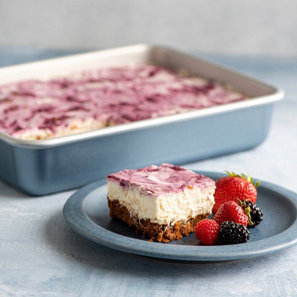 Nordic Ware nonstick aluminum 9x13 baking pan with rippled bars, silver finish, single bar piece shown alongside