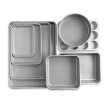 Nordic Ware 8-piece nonstick baking pan set with various rectangular and round pans in charcoal gray finish