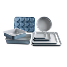 Nordic Ware Brilliant Bakeware 8-piece nonstick baking set with silver aluminum pans arranged on white background