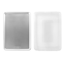 Nordic Ware aluminum big sheet pan with fitted lid, both pieces shown separately on white background