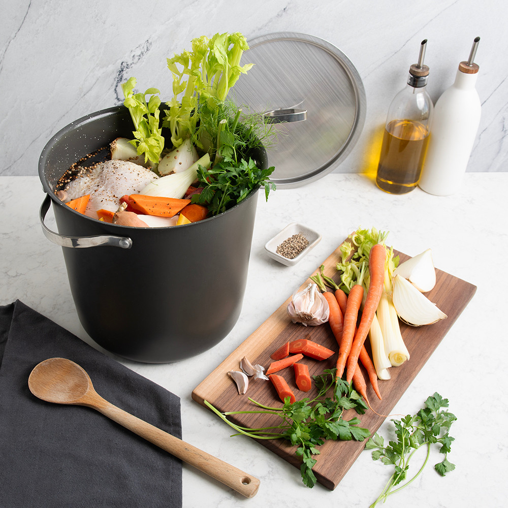 Verde 12 Qt Stockpot with Lid on countertop with veggies