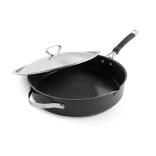 Nordic Ware Verde 12-inch ceramic nonstick skillet with glass lid, forest green exterior, angled view