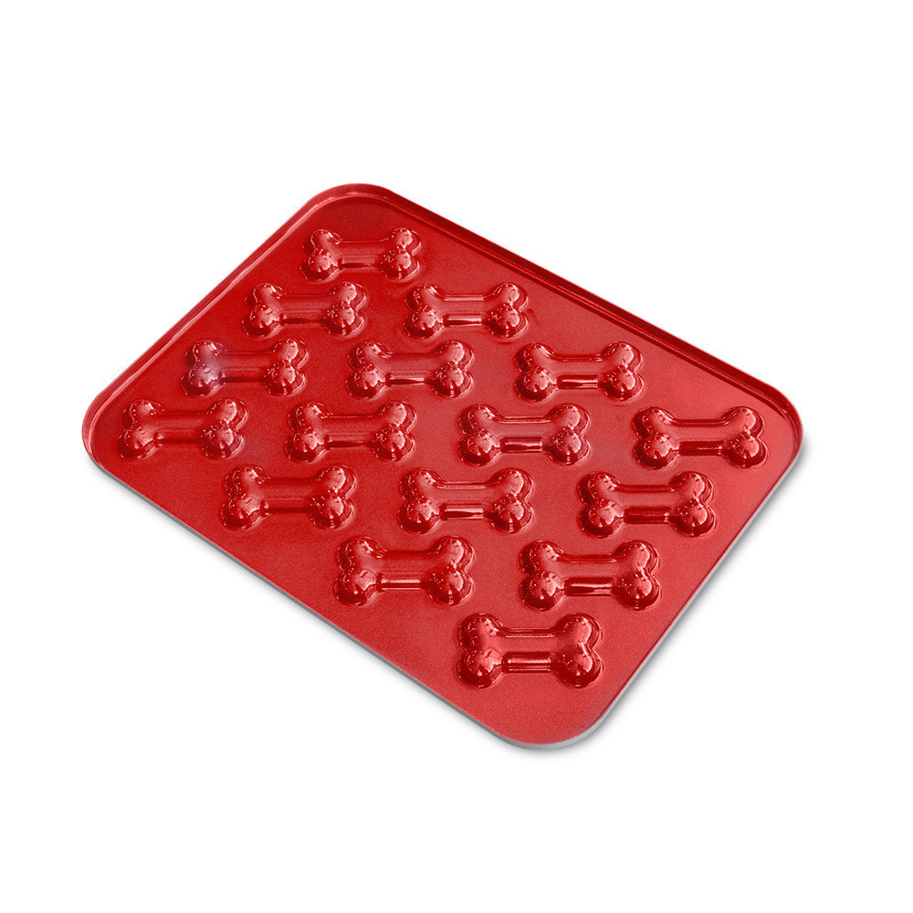 Nordic Ware red aluminum baking pan with six puppy-shaped cavities for making dog treat cookies