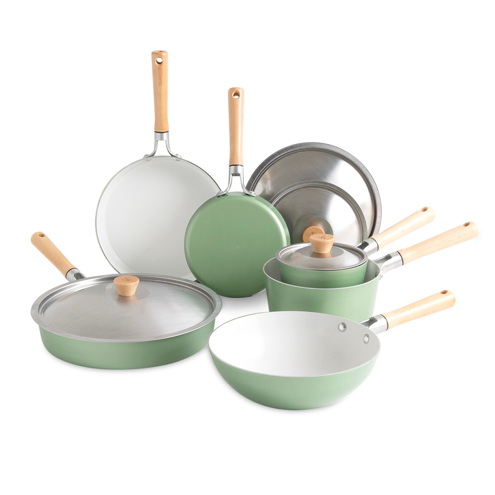 Nordic Ware Cardamom 10-piece nonstick cookware set in cream color with matching lids on white background