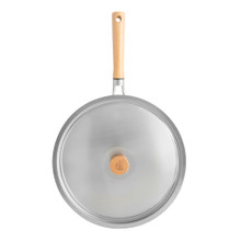 Nordic Ware Cardamom 12-inch nonstick frying pan with glass lid, cream exterior, black interior