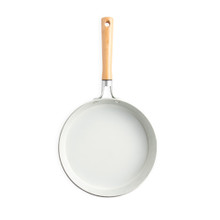 Nordic Ware Cardamom ceramic nonstick 10-inch skillet interior, cream-colored cooking surface with raised sides