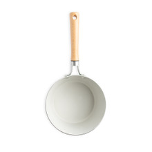 Nordic Ware 3-quart cardamom ceramic nonstick saucepan interior view, showing light cream-colored coating