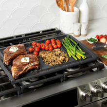 Two grilled steaks with seared tomatoes, onions, mushrooms and asparagus on Nordic Ware basalt dual-zone grill griddle