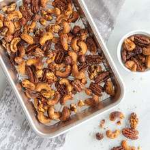 Golden candied nuts baked on Nordic Ware aluminum eighth sheet pan with raised edges