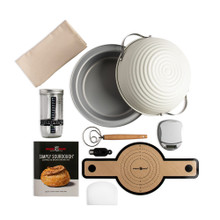 Nordic Ware Simply Sourdough bread baking kit with aluminum loaf pan, proofing baskets, tools and accessories arranged overhead