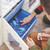 UbeCube™ CratePlay™ storage crate with pull-out bin filled with blue LEGO® bricks being sorted during play (toy storage, modular play system)