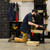 Tradesman kneeling in workshop using UbeCube Tradesman Single™ utility kit with Drop-In Tray and organized tools