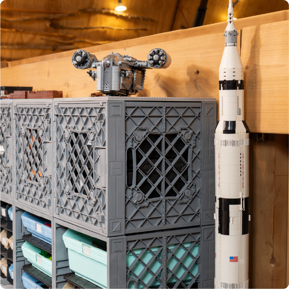 LEGO-compatible spaceship and rocket models displayed on top of gray UbeCube crates in a CratePlay storage setup.