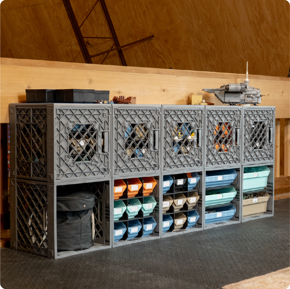 LEGO-compatible spaceship and rocket models displayed on top of gray UbeCube crates in a CratePlay storage setup.