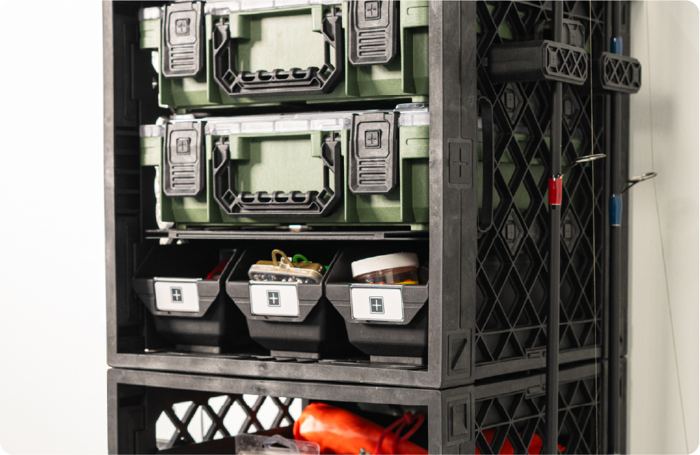Black UbeCube fishing tower with stacked BaseBoxes, Grab Bins, tackle storage, and side-mounted fishing rod holders.
